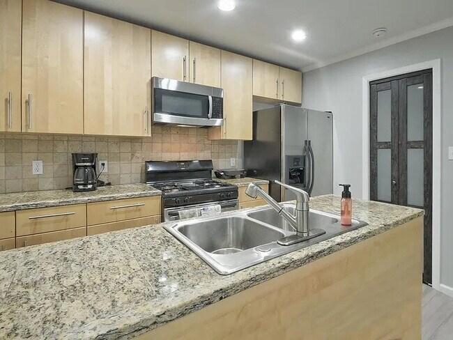 Building Photo - Updated North Austin Townhome with Exceptional Outdoor Space