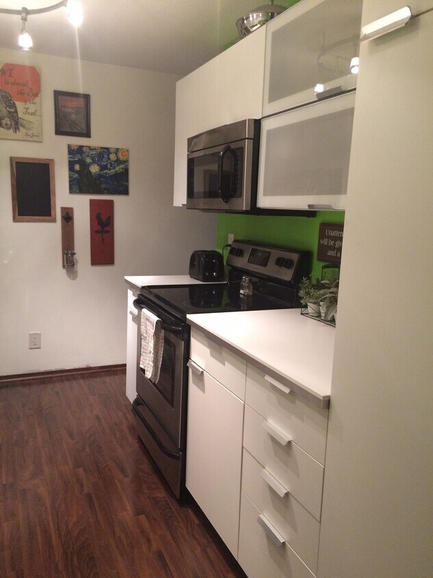Updated cabinetry and undermount microwave. - 132 Demont Ave. East