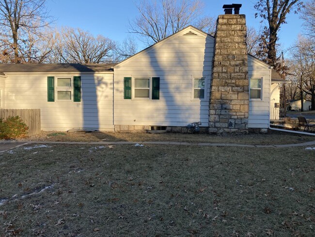 west side of exterior and yard - 230 Park Ave