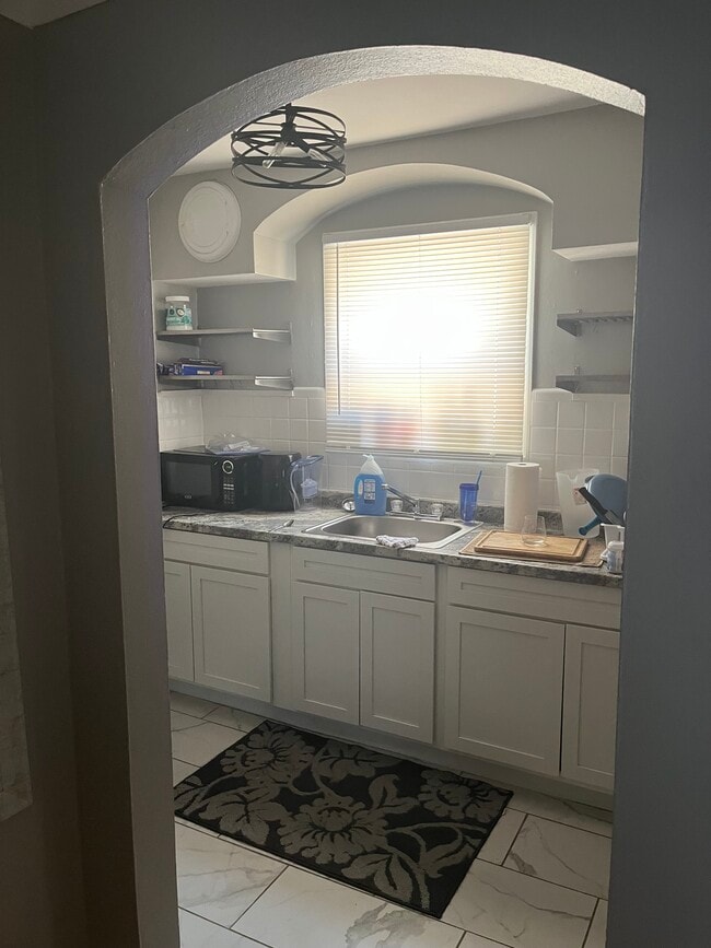 Kitchen. Stainless steel appliances. Microwave and air fryer. - 6139 Alaska Ave