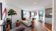Located in the heart of West Hollywood at 1250 N Fairfax Avenue, this thoughtfully designed single-floor residence combines contemporary finishes with warm, curated interiors. Distinctive herringbone-patterned hardwood floors flow throughout every room, establishing an elegant and cohesive aesthetic from entry to bedroom.

The bright, open living area is anchored by large sliding glass doors and black-framed windows that frame sweeping views of the Hollywood Hills and surrounding neighborhood, while also bathing the space in abundant natural light. The living area connects seamlessly to a dedicated dining space, perfect for entertaining.

The kitchen is well-appointed with sleek, light gray cabinetry, stainless steel Bosch appliances including a gas range, dishwasher, microwave, and refrigerator, all complemented by a bold geometric black-and-white tile backsplash and light stone countertops.

The bedroom is a comfortable retreat, featuring generous natural light from a large window, curated wall art, and direct access to a walk-in closet. Two bathrooms carry a consistent design language, showcasing the same striking patterned encaustic floor tiles, classic white subway wall tiles, and clean-lined vanities.

A hallway with a sliding door and recessed lighting leads gracefully between spaces, with a vibrant piece of artwork providing a striking focal point at the corridor's end.
