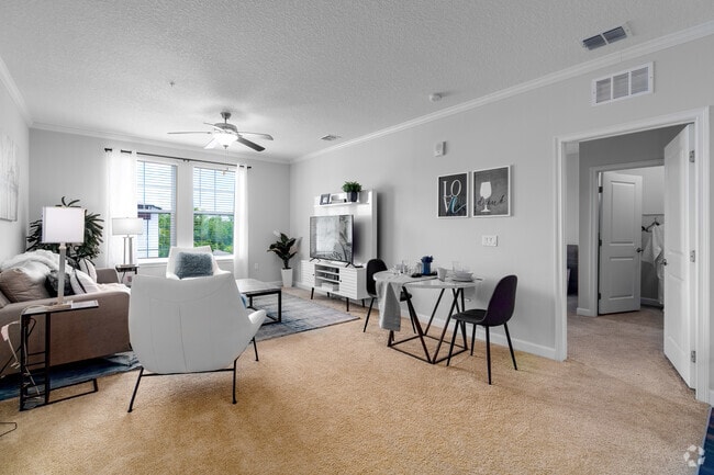 2BR, 2BA - 1,130SF - Living Room - The Oasis at Moss Park Preserve