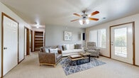 Located at 525 Stone Pointe Dr in Manhattan, Kansas, this single-floor, 2-bedroom, 1-bathroom home offers a thoughtfully designed layout that maximizes comfort and functionality. The inviting living room features plush carpeting, a ceiling fan with light fixture, and large windows alongside a glass door that opens to a private balcony, filling the space with natural light and outdoor views. An open entryway with additional ceiling fan provides a welcoming transition into the home.

The kitchen is well-equipped with warm honey-toned wood cabinetry, ample counter space, tile flooring, and white appliances including a refrigerator, range, and dishwasher. A chandelier-lit dining area with a built-in table and bar seating adds a charming and practical touch.

The spacious primary bedroom features soft carpeting, a natural light-filled window, and direct access to the shared full bathroom. The second bedroom also offers carpeted flooring, a window with outdoor views, and a walk-in closet with built-in shelving. The full bathroom includes tile flooring, wood cabinetry, a vanity, and a shower-tub combination. Two hallways and two closets provide ample storage throughout, completing this comfortable and efficiently arranged home.