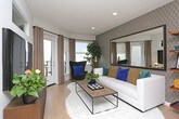 Located at 421 Cypress Ave in South San Francisco, this single-floor residence offers a thoughtfully designed layout with modern finishes and a cohesive contemporary aesthetic throughout.

The kitchen is a functional highlight, featuring flat-front wood-tone cabinetry, white quartz countertops, and a subtle subway tile backsplash. Stainless steel appliances — including a refrigerator, range, microwave, and dishwasher — are seamlessly integrated, while light hardwood-style flooring adds warmth. The kitchen flows naturally toward a living area, which benefits from large windows and a glass door leading to an outdoor balcony, filling the space with natural light and providing outdoor access.

The bedroom is designed with contrast in mind, featuring a deep charcoal accent wall that anchors the room. A large wall-mounted mirror amplifies the sense of space, while a wall-mounted TV and a warm wood dresser add practical style. Carpeted flooring contributes to a cozy atmosphere.

The bathroom continues the bold palette with deep navy-blue walls paired with light hardwood-style flooring. A full tub-shower combo, a clean white vanity, and a wood-framed mirror with an above-toilet cabinet complete the space with a balanced mix of contrast and functionality.