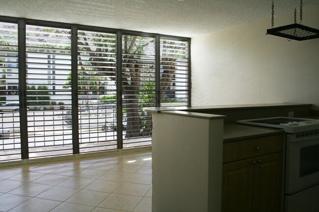 View of kitchen island and dining area - 3030 Pualei Cir