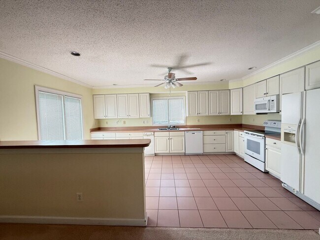Building Photo - Luxury 3-Story Home Near Chic’s Beach with Water Views & Private Decks