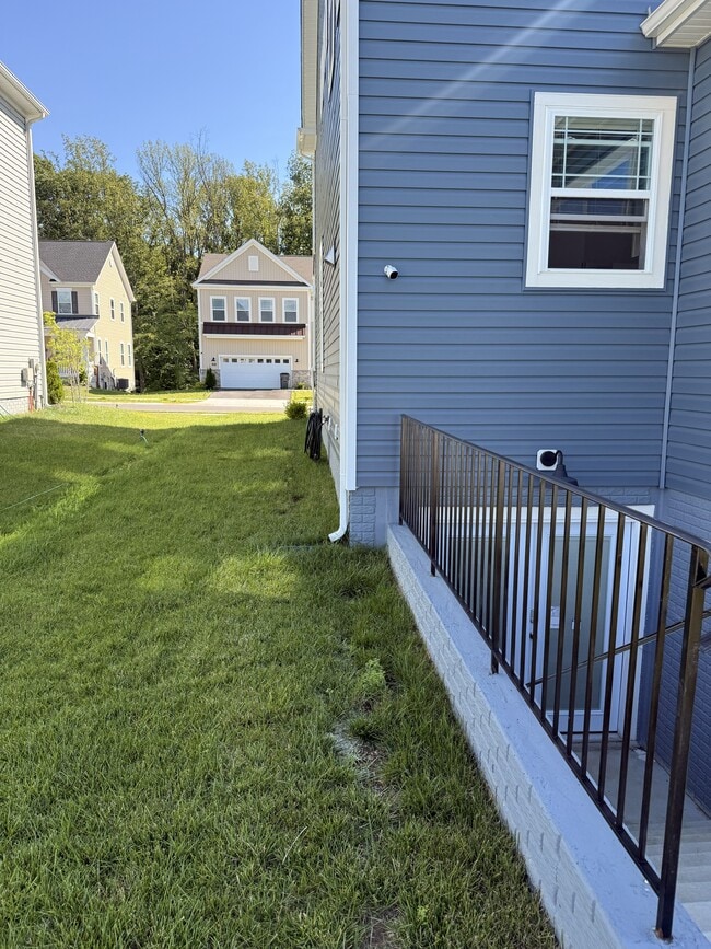 Walkway to the entrance is scheduled to be paved. - 2907 Bridgewater Dr