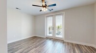 Located at 484 Lazelle Rd in Columbus, OH, this well-designed one-bedroom, one-bathroom unit offers a practical and modern layout across a single floor. Hardwood-style flooring flows throughout the main living areas, complementing the clean, neutral color palette that creates a bright and cohesive atmosphere.

The living room is a comfortable, open space highlighted by a ceiling fan with integrated lighting and a set of French doors that open to a private balcony, filling the room with natural light and providing pleasant outdoor views.

The kitchen is thoughtfully appointed with white shaker cabinetry, marble-look countertops, a classic tile backsplash, and a full suite of stainless steel appliances including a refrigerator, electric range, microwave, and dishwasher. An adjacent pantry provides additional storage convenience.

The bedroom features plush carpeting, a horizontal accent window, and access to a dedicated closet with wire shelving. The bathroom offers a clean, spa-like feel with a white vanity, marble-look countertop, and hardwood-style tile flooring. An in-unit laundry area adds everyday practicality. Together, these spaces deliver a functional and stylish living environment in a convenient Columbus location.