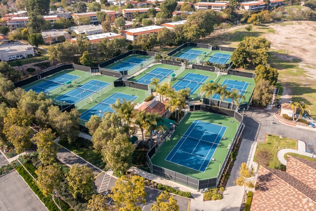 Play a match of tennis at the tennis complex in Laguna Hills.