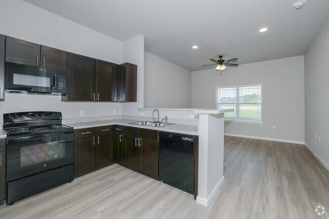 1BR, 1BA - 702SF - Living Area and Kitchen - Coweta Trails I & II