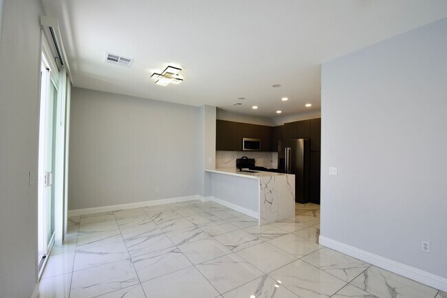 Building Photo - Charming Mediterranean-Style Townhome in G...