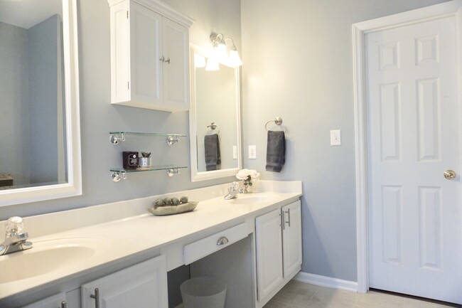 Master bath includes double vanity, spacious walk-in closet and linen closet - 621 Glenolden Ct