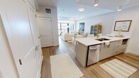 This contemporary 610 square foot apartment in London, Ontario, offers a harmonious blend of style and functionality. The space features one bedroom and one bathroom, ideal for singles or couples seeking a modern urban lifestyle. The open-concept design seamlessly integrates the kitchen, living, and dining areas, maximizing the use of space.

The kitchen boasts sleek white cabinetry, stainless steel appliances, and a spacious island with seating, perfect for casual dining or entertaining. The living area is bathed in natural light from large windows, offering stunning city views. Comfortable seating and tasteful decor create an inviting atmosphere for relaxation.

The bedroom, measuring 130 square feet, features a plush bed, ample storage, and continues the apartment's contemporary aesthetic. The bathroom showcases a luxurious walk-in shower with floor-to-ceiling marble-effect tiling, adding a touch of elegance.

Throughout the apartment, neutral tones are accented with pops of color in the furnishings and artwork, creating a sophisticated yet warm ambiance. Hardwood floors, recessed lighting, and carefully curated decorative elements complete the polished look of this urban oasis.