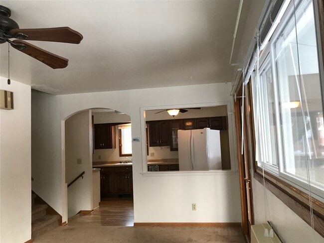 Porch to right, kitchen back through arch - 5202 Schofield St