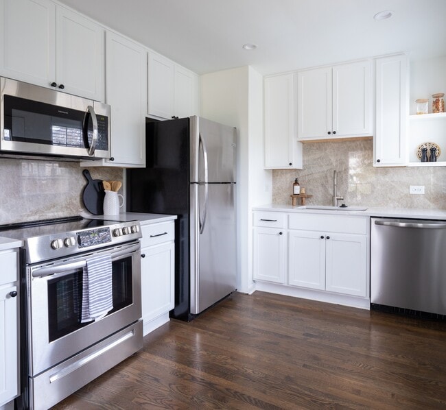 Gourmet kitchen with all new appliances. Refrigerator and microwave included with unit. - 203 Leake Ave