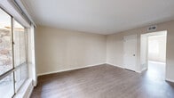 This single-story, 3-bedroom, 1-bathroom unit in El Paso, TX offers a practical and well-organized layout across a compact but efficiently utilized floor plan. Light-toned luxury vinyl plank flooring runs throughout the home, providing a clean, cohesive look that ties each room together.

The living room is a comfortable, open space with neutral beige walls and smooth ceilings, offering a welcoming area for everyday use. Adjacent to the living room, the kitchen features white cabinetry, dark countertops, a gas range, and a full-size refrigerator, all illuminated by overhead fluorescent lighting. The kitchen's efficient layout maximizes the available space.

Each of the three bedrooms is finished with the same light-toned flooring and neutral walls. The bedrooms benefit from natural light streaming in through vertical-blind-covered windows, with some offering views of the surrounding rocky landscape — a characteristic feature of the El Paso environment. The primary bedroom provides a comfortable footprint with a dedicated closet nearby.

A central hallway connects the bedrooms and the shared bathroom, with textured ceilings present in several rooms adding a subtle design element. The overall ambiance of the unit is clean, bright, and move-in ready, making it a functional option in the west El Paso area.