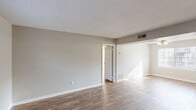 This single-floor residence in Augusta, Georgia offers a well-organized layout comprising two bedrooms, one full bathroom, a living room, a kitchen, and a connecting hallway. Wood-style plank flooring runs throughout the home, providing a cohesive and easy-to-maintain surface across all rooms.

The living room is an open, well-lit space featuring neutral gray-toned walls, textured ceilings, and visible HVAC vents. Natural light filters in generously, creating a bright and welcoming atmosphere. The room flows easily into the rest of the home via the hallway.

The kitchen is efficiently designed with white cabinetry, a dual-basin stainless steel sink, light countertops, and a built-in dishwasher. A windowed door provides natural light and direct access to the exterior.

Both bedrooms are modestly sized, each featuring a dedicated closet with a full-width rod for hanging storage, neutral walls, and windows that allow natural light. The primary bedroom offers a comfortable footprint suitable for standard bedroom furnishings.

The bathroom is cleanly appointed with a tiled shower-tub combination, a toilet, a single-basin vanity with a mirror, and wood-style flooring. The overall design of this residence is practical and straightforward, with a neutral palette throughout that offers a versatile canvas for personalization.