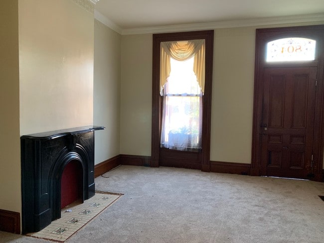 Living room with decorative fireplace - 804 Main St