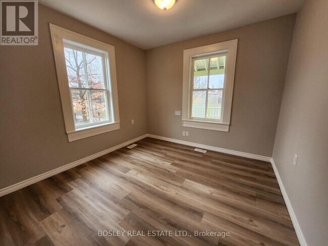 Building Photo - 5958 6th Avenue Wood