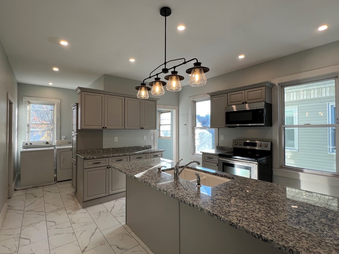 New kitchen with in-unit laundry - 56 State St