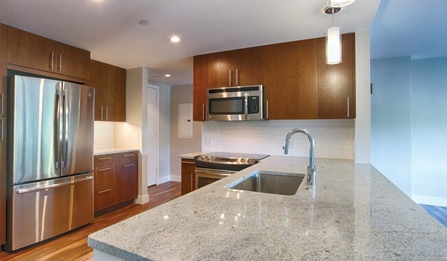 Quartz vanity countertops, spacious walk-in showers, and ample lighting are featured in our penthouse bathrooms - Park Towne Place Apartments