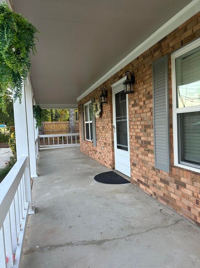 Building Photo - Move-In Ready Corner-Lot Home with Wraparound Porch Near Fort Eisenhower