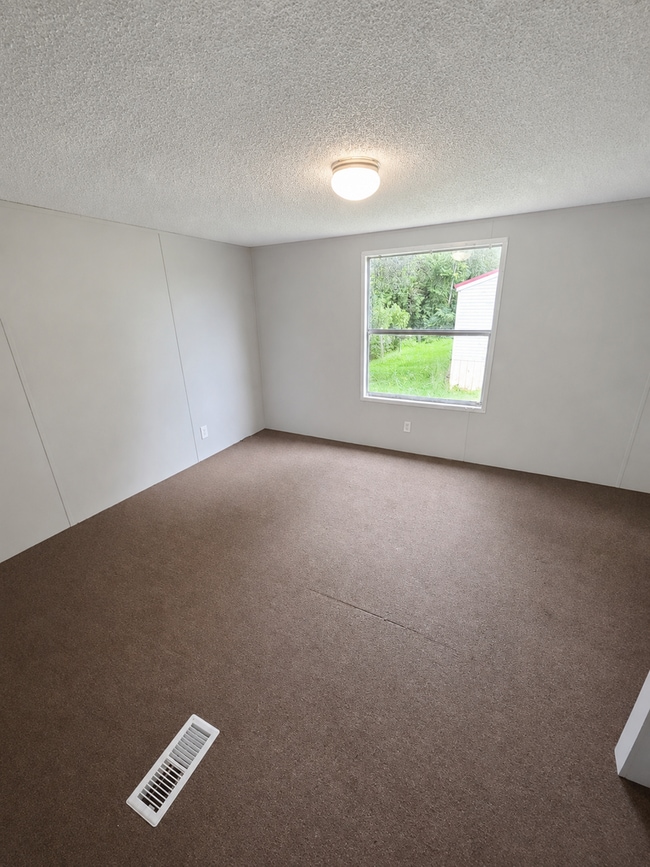 Building Photo - 2-Bedroom Home with New Wooden Deck in a Peaceful Sparta Setting