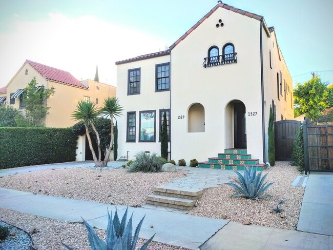 Gated driveway and yard. - 1327 S Sycamore Ave