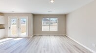 This 1400 square foot home in Hazel Green, Alabama offers a blend of comfort and modern design across two floors. The property features four bedrooms and four bathrooms, providing ample space for a family or those who enjoy extra room. The primary bedroom, measuring 160 square feet, offers a generous retreat.

The heart of the home is a bright, contemporary kitchen boasting white cabinetry, granite countertops, and stainless steel appliances. An island provides additional workspace and casual seating. The open concept living area flows seamlessly from the kitchen, creating an ideal space for entertaining.

Throughout the home, wood-look flooring adds warmth and durability. The bathrooms are outfitted with modern fixtures, including pedestal sinks and granite vanity tops. Large windows in the bedrooms allow for plenty of natural light, while closet systems offer organized storage solutions.

A garage provides secure parking and additional storage space. The property's layout includes convenient features such as a staircase connecting the two floors and hallways for easy navigation. With its blend of style and functionality, this home presents an attractive option for those seeking a modern living space in Hazel Green.
