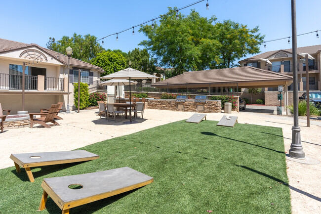 Corn hole ane lounge area - Cypress Villas Apartment Homes