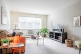 Located at 5405 Century Ave in Middleton, WI, this one-bedroom, one-bathroom unit offers a well-organized, single-floor layout designed for comfortable everyday living. The open-concept living and dining area is bright and welcoming, featuring soft carpet underfoot, neutral warm-toned walls, and a large window that draws in generous natural light while offering views of the surrounding neighborhood. The space flows seamlessly from the dining area into the living room, creating an inviting area suitable for both relaxing and entertaining. Adjacent to the living space, the galley-style kitchen is efficiently laid out with white cabinetry, light stone-finish countertops, a full suite of white appliances including a range and refrigerator, a built-in dishwasher, and a stainless steel sink — all set on easy-care hardwood-style flooring. The bedroom is a comfortable, carpeted retreat with a window providing natural light and ample space for furnishings. Three closets throughout the unit provide excellent storage. The full bathroom features a clean, all-white tub and shower combination. A hallway connects the rooms with ease, completing a practical and cohesive floor plan well-suited for single occupancy or couples.