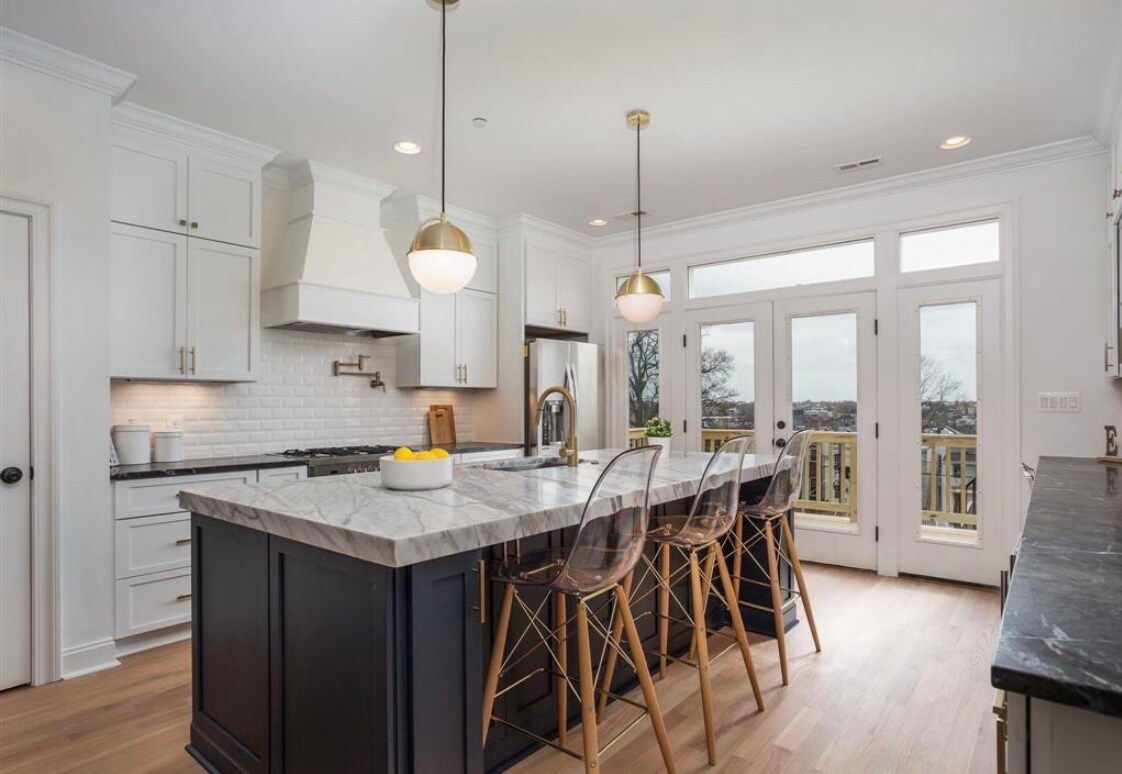 Open concept chefs kitchen with marble island and counters - 1247 Oates St NE