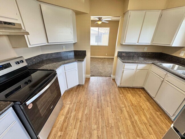 Building Photo - THIS SECOND-FLOOR DESERT SHORES CONDO OFFE...