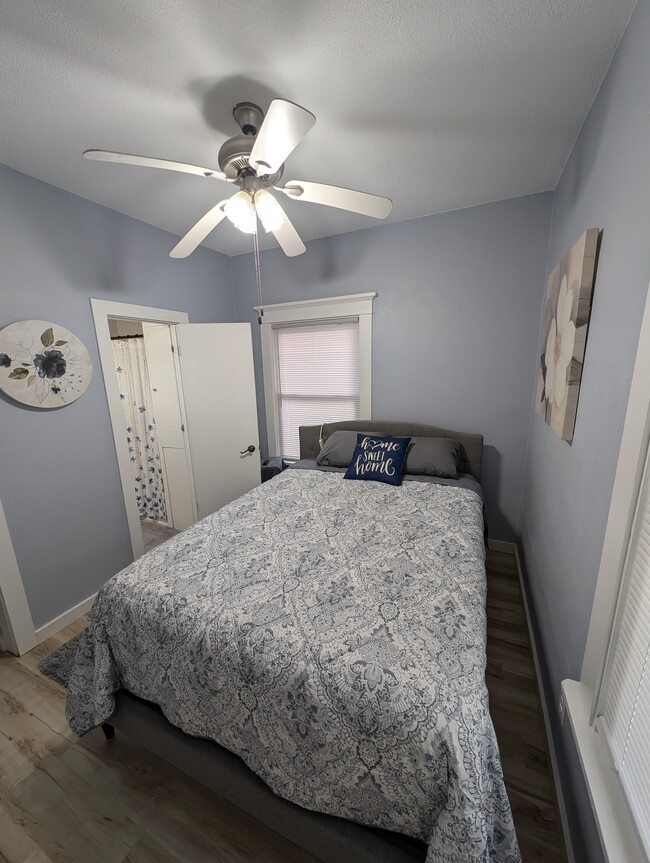 Queen bed and TV mounted on wall - 1120 J Ave NW