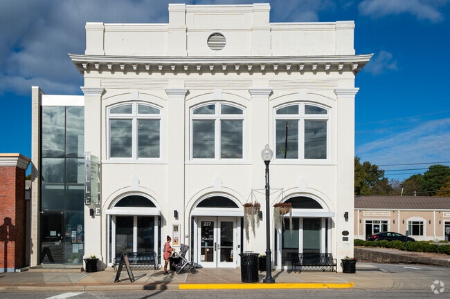 Check out art exhibits at the Federal-style Halle Cultural Arts Center in downtown Apex.