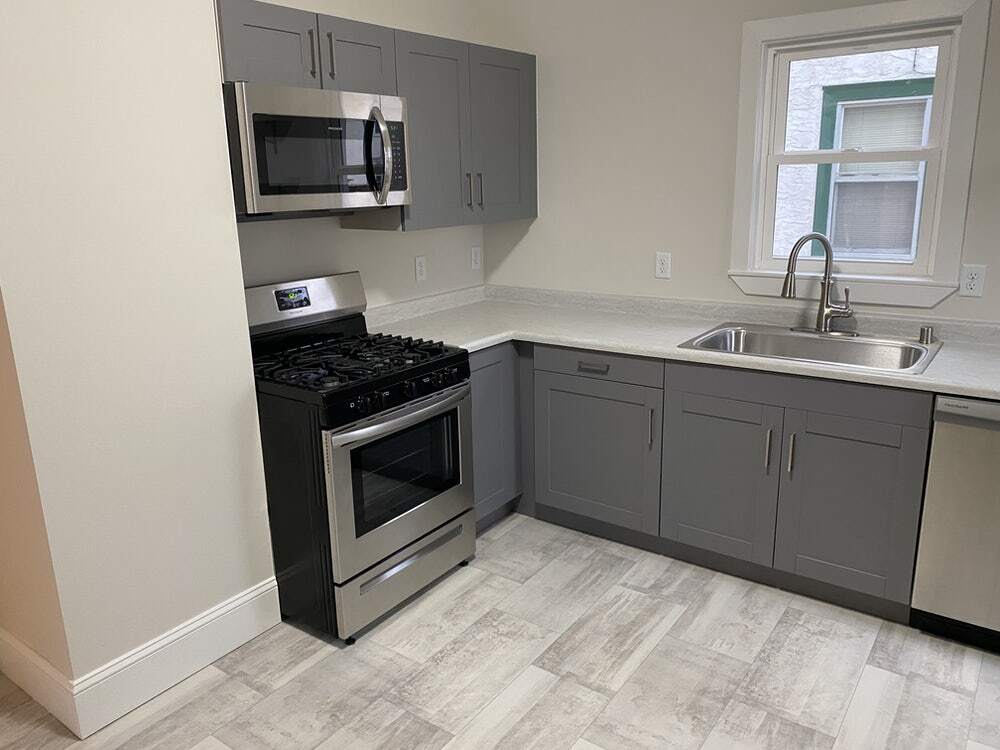 Kitchen, w/ Stainless Steel Range, Oven and microwave. - 3052 California St NE