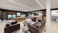 Located at 1188 King St in Greenwich, Connecticut, this thoughtfully designed single-floor space offers a generous, open-plan layout that balances elegance with functionality. The main living area is expansive, anchored by a striking feature wall clad in warm vertical wood slat paneling, housing a large flat-screen display and a sleek low-profile cabinet with ample storage. Recessed linear LED lighting runs across the ceiling, casting a clean, modern glow throughout the space. Herringbone-patterned hardwood flooring adds a refined texture underfoot, complementing the rich, dark-toned accent walls. Multiple seating arrangements — including plush velvet sofas and armchairs — define distinct lounge zones, while a large dining table with upholstered chairs accommodates generous gatherings. A built-in wet bar and cabinetry with open shelving and under-counter refrigeration provide seamless entertaining capabilities. Curated greenery, artwork, and decorative accessories are thoughtfully placed throughout, enhancing the upscale ambiance. The bathroom is clean and contemporary, finished with large-format grey tile flooring and half-wall tiling, a wall-mounted sink, a backlit mirror, and accessibility-focused fixtures. Together, these spaces create a polished, professional environment ideal for hospitality or collaborative use.