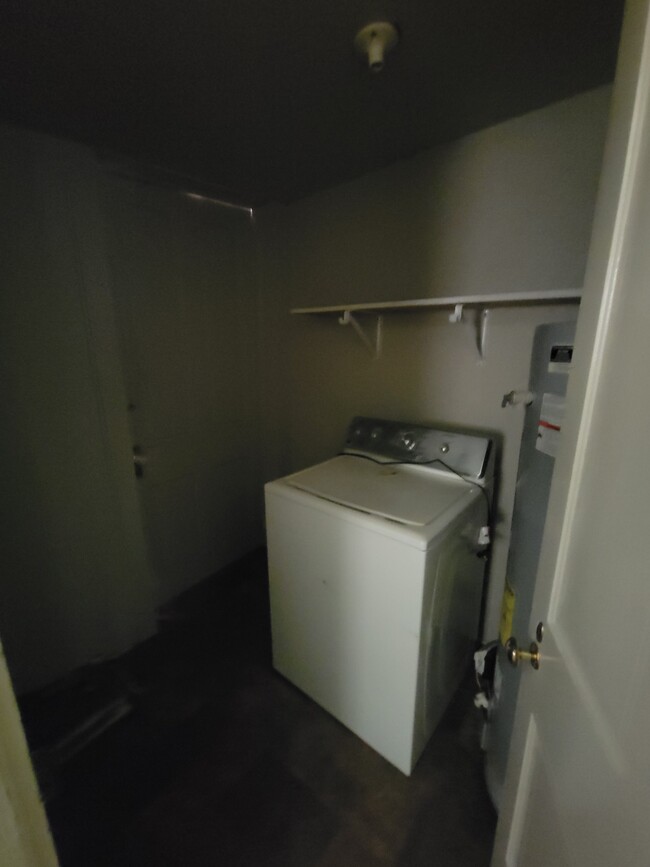 Laundry room with door to small back porch. - 200 Taylor St