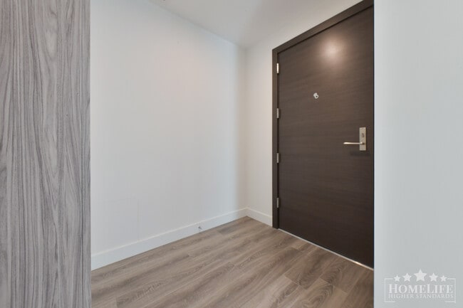 Photo du bâtiment - Stunning 2 Bedroom 2 Bathroom Condo at The Grand with Wraparound Deck Views and Concierge Living