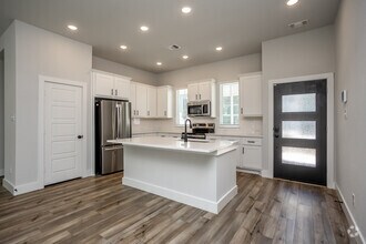 3BR, 2BA - 1,369SF - Kitchen - Canopy Homes at Woodcreek