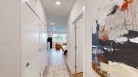 Located in the heart of Nashville's vibrant East Side, this thoughtfully designed studio unit at 401 S Fourth St offers a smart, open-concept layout that maximizes every inch of its single-floor footprint. The main living area seamlessly combines sleeping, lounging, and dining zones, all unified by warm luxury vinyl plank flooring and neutral wall tones that create a bright, welcoming ambiance. Recessed lighting throughout keeps the space feeling airy and well-lit.

The kitchen is a standout feature, showcasing crisp white shaker cabinetry with matte black hardware, granite countertops, and a bold deep-blue subway tile backsplash that adds a striking design accent. A full suite of stainless steel appliances — including a range, microwave, refrigerator, and dishwasher — makes this kitchen highly functional for everyday use.

The living area offers ample room for a comfortable seating arrangement alongside a sleeping area, with a double-door closet providing convenient storage. The bathroom features a full tub-shower combination with clean white tile surround and chrome fixtures, maintaining the unit's consistent modern aesthetic.

Situated in a ground-floor location, this unit is an efficient and stylish option in one of Nashville's most dynamic neighborhoods.