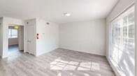 Located at 6347 Melody Lane in Dallas, TX, this one-bedroom, one-bathroom unit offers a well-organized, efficient layout across a single floor. Light wood-look flooring flows throughout the space, lending a clean and cohesive aesthetic to every room.

The combined kitchen and living area serves as the heart of the unit. The kitchen is equipped with stainless steel appliances, including an electric range, over-the-range microwave, and refrigerator, complemented by soft sage-green cabinetry, light countertops, and a double-basin sink. The living area receives generous natural light through a large window, creating a bright and welcoming atmosphere.

The bedroom is a comfortable, well-proportioned room featuring a ceiling fan with light fixture, neutral white walls, and continued wood-look flooring. A dedicated closet provides convenient storage directly off the bedroom.

The bathroom is a standout feature, showcasing large-format dark slate-toned tile surrounding the full tub and shower combo. Matte black fixtures add a modern contrast against the crisp white tub and toilet, creating a bold yet functional space.

Throughout the unit, clean white walls, consistent flooring, and thoughtful finishes contribute to a bright, move-in-ready environment suited for comfortable everyday living.