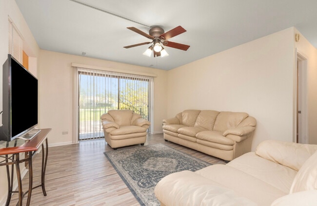 Spacious well lit living room with balcony access - 80 S Pleasant Rd