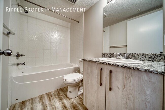 Photo du bâtiment - GREAT 2 BEDS/ 2 BATHS CONDO IN THE COMMUNITY OF SKYVIEW