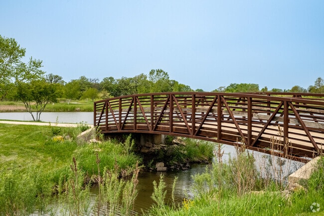 Traverse the bridge over the southernmost pond at Lerner Conservation Park.