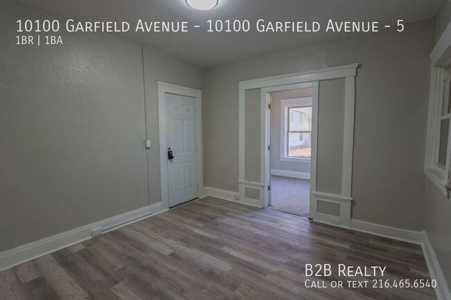 Building Photo - "Charming 1-Bedroom Oasis: Your Perfect Bl...