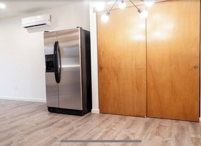 Dining room with large enclosed pantry and fridge - 1705 Norman St