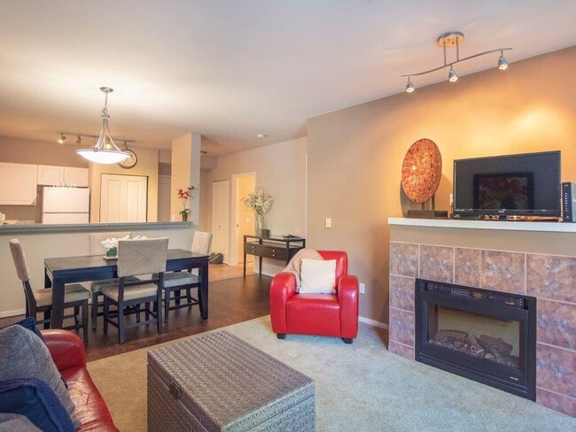 Open Living With Fireplace at Metropolitan Collection Apartments - Metropolitan Collection Apartments