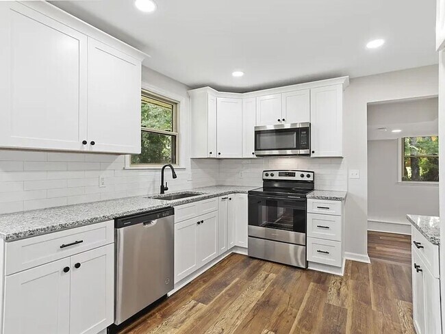 Building Photo - Welcome home to space, comfort, and thoughtful updates in this beautifully maintained 5-bedroom, ...