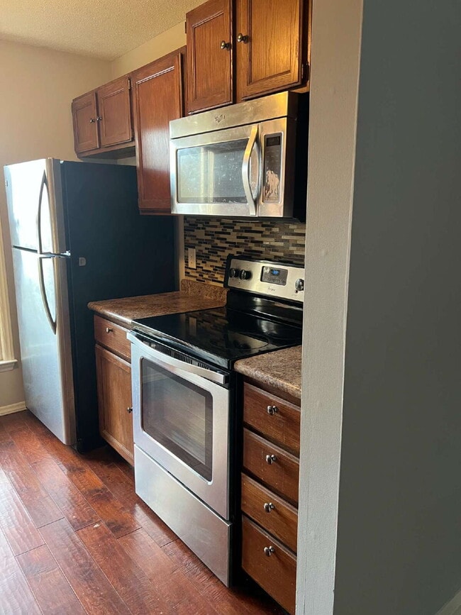 Photo - Charming 3 bedroom 2 bath townhome with lots of light and open downstairs. Galley kitchen, lots o...